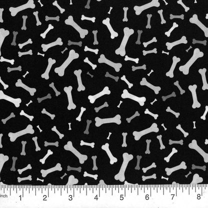 Pattern of white bones on a black background with a ruler at the bottom.