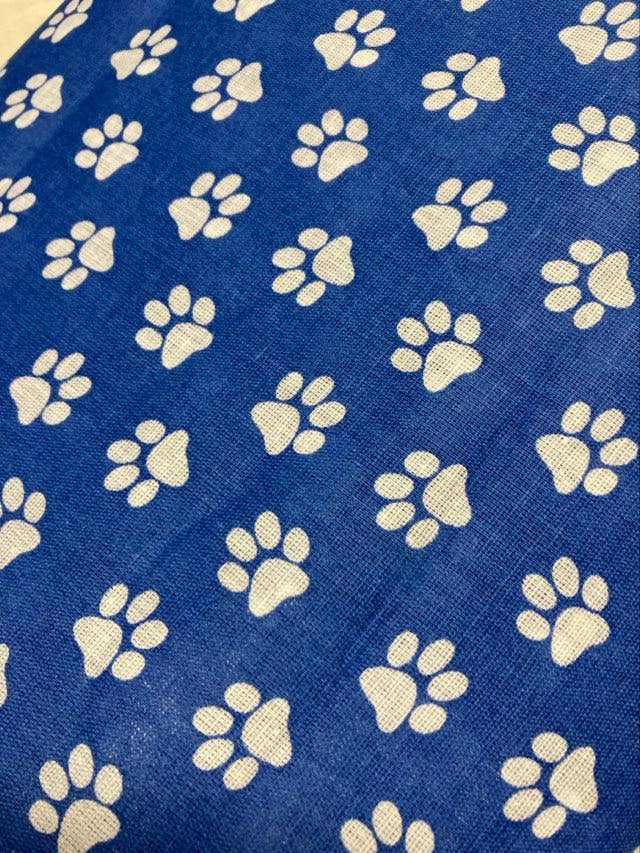 Blue fabric with white paw prints pattern