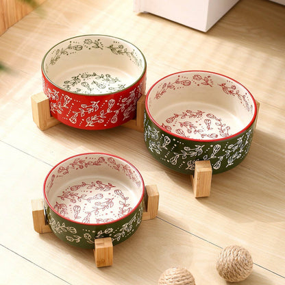 Three ceramic bowls with floral patterns on a wooden surface