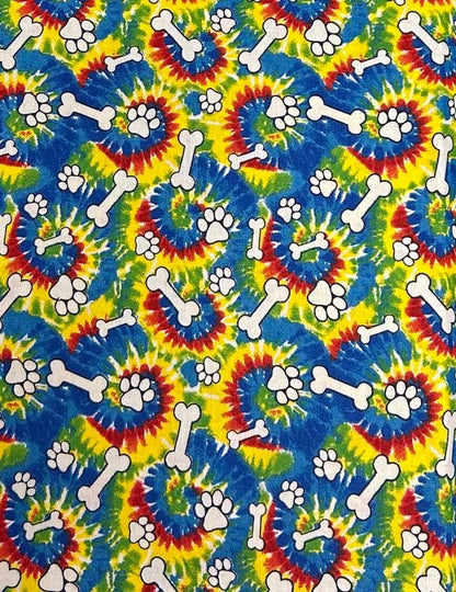 Tie-dye pattern with bones and paw prints on a colorful background