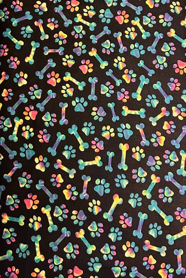Colorful pattern of bones and paw prints on a black background