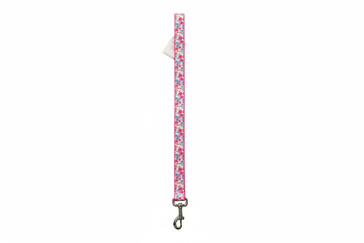 Floral patterned dog leash on a white background