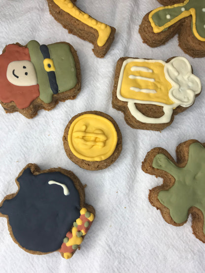 Decorative cookies with various designs on a white surface