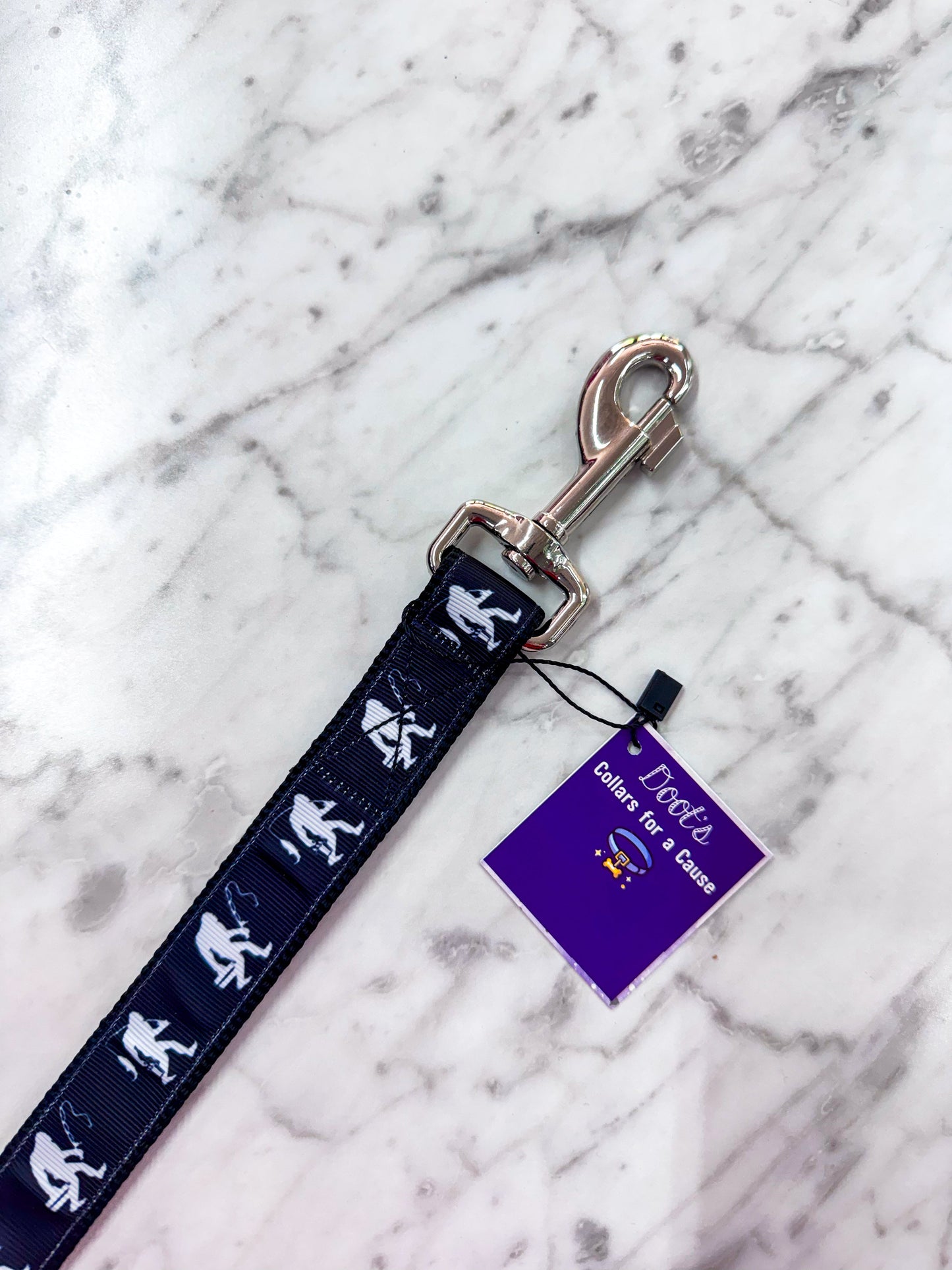 Dog leash with Sasquatch design on a marble surface