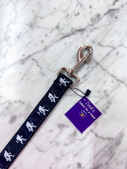 Dog leash with Sasquatch design on a marble surface