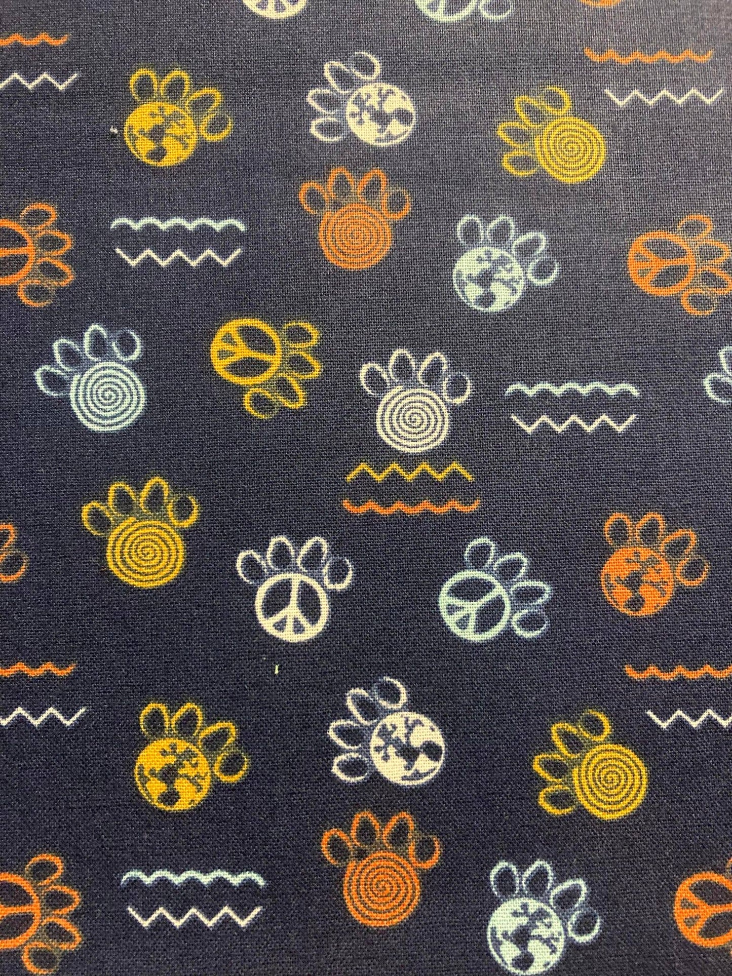 Patterned fabric with various symbols on a dark background