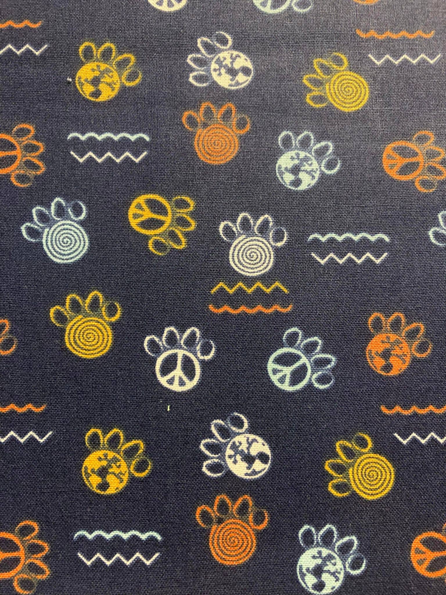 Patterned fabric with various symbols on a dark background