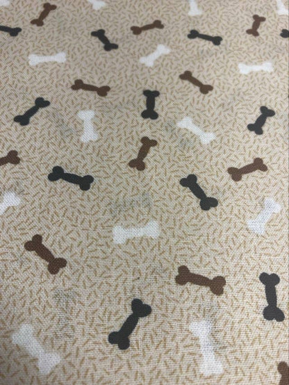Pattern of dog bones on a textured beige background